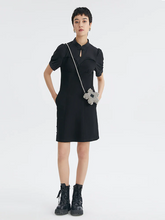 a lady in black mini cheongsam dress